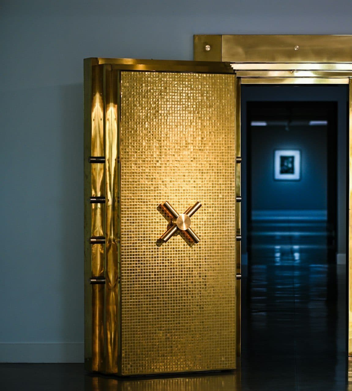 Gleaming golden vault door symbolizing secure cargo handling